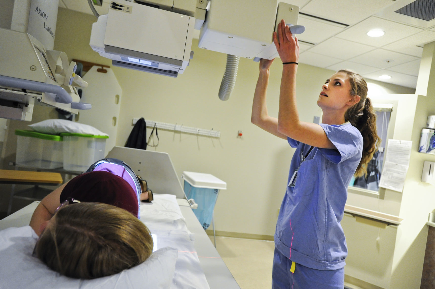 Jesica George, a radiation tech, x-rays a patient recently at St. Peter's Health.